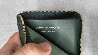 The brand and country of manufacture are imprinted inside the wallet