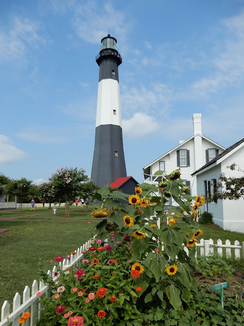 lighthouse and sunflowers