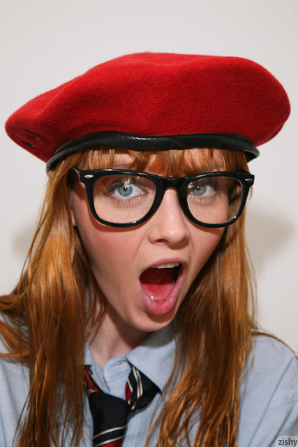 Marie McCray wearing red cap and glasses