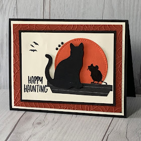 Halloween card with a cat and mouse in silhouette looking at the moon