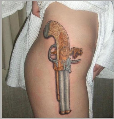 gun tattoos on hips