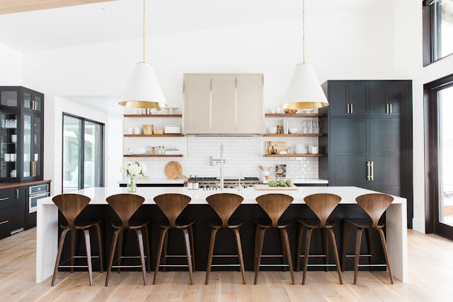 Beautiful kitchen with huge island bar stool in modern mountain urban minimal interior design room