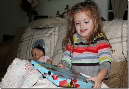 Zoey opening her Christmas Eve gift