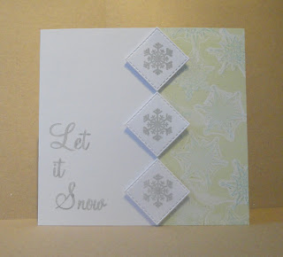 Christmas card with green and blue snowflake pattern on right and Let it Snow sentiment