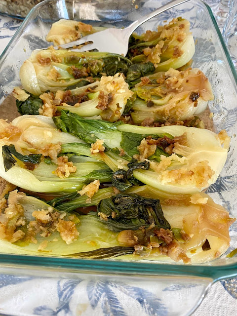 boy choy with ginger and walnuts in a pyrex casserole