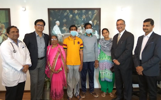 Dr. Sudarshan Ballal and Dr. Deepak Dubey with patients