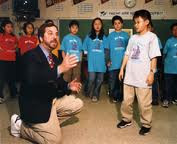 Rafe instructing one of his students in a play