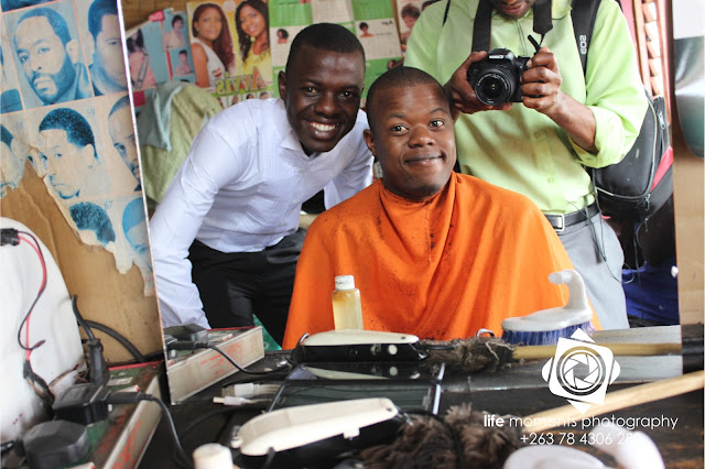 Picture By Life Moments Media. Tonderai Gondwa undergoing hair grooming and cut before his wedding.