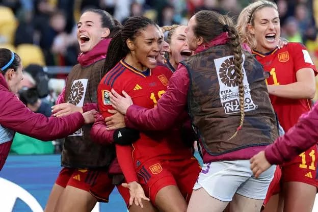 Spain players celebrate reaching the FIFA Women's World Cup final for the first time after beating Sweden 2-1 in the semi final