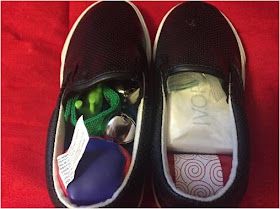 Tucking things inside a pair of shoes for an OCC shoebox gift.