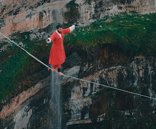 A man walking on a tightrope