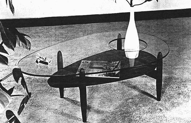 a photograph of an Adrian Pearsall table with hole in the glass top