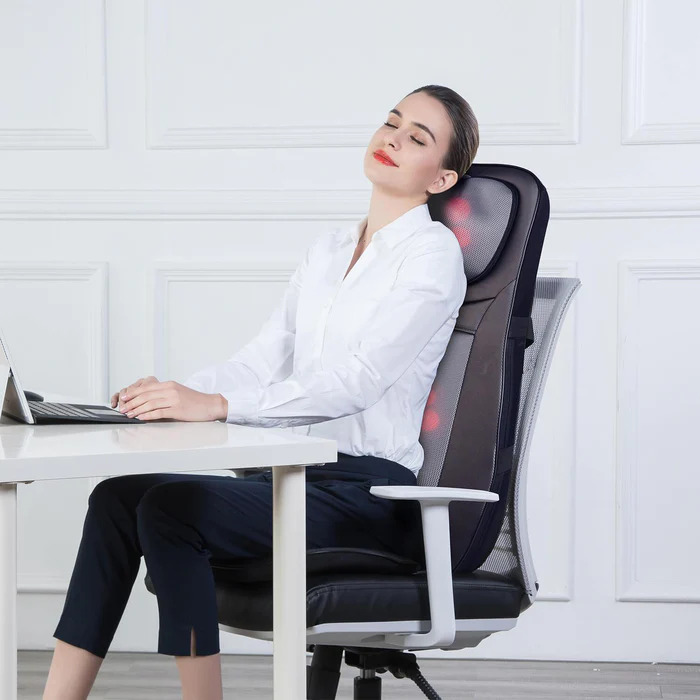 Woman getting a massage sitting in chair-Snailax massagers