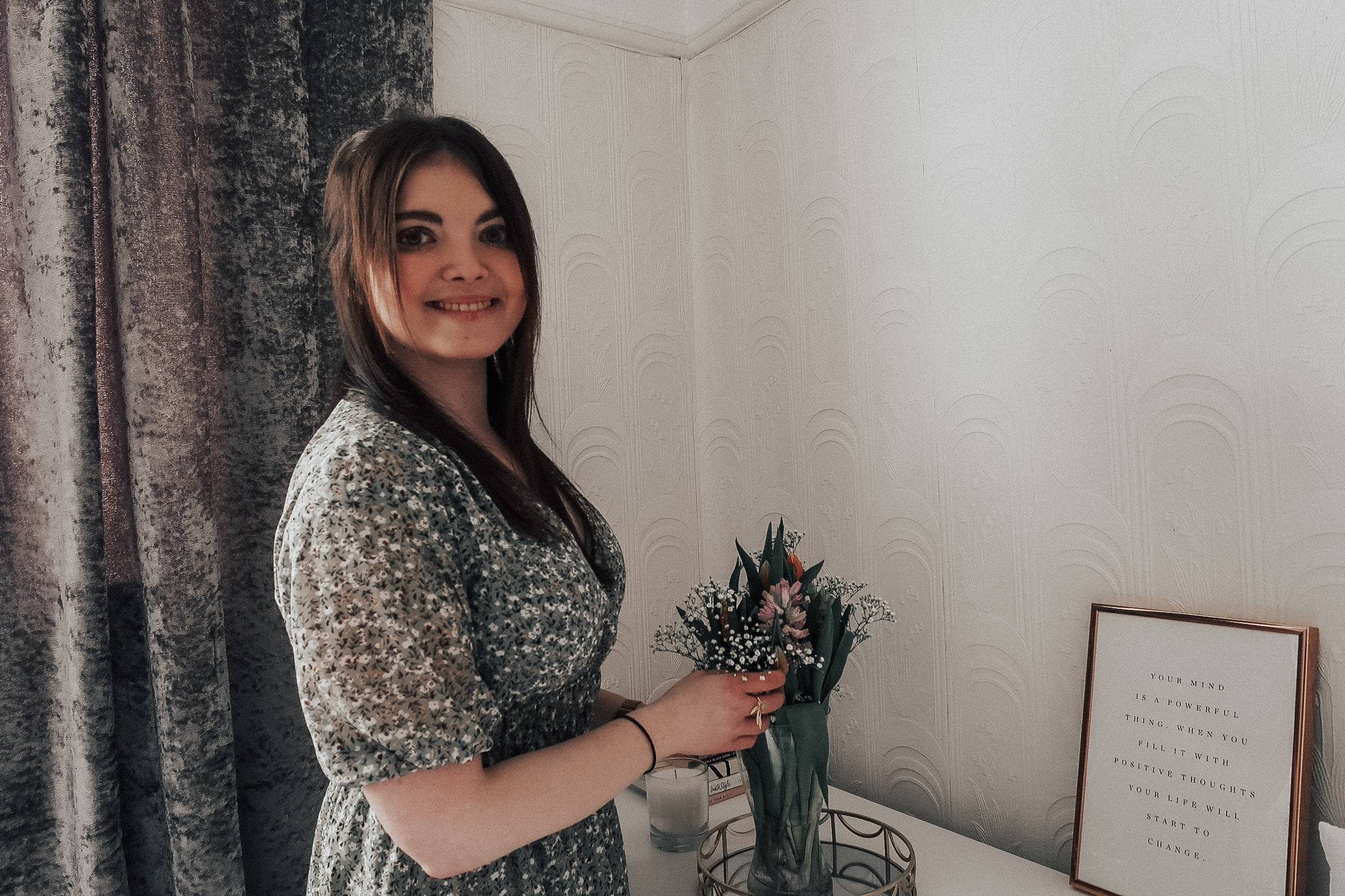 A woman holding a bouquet of flowers (Spring self-care)