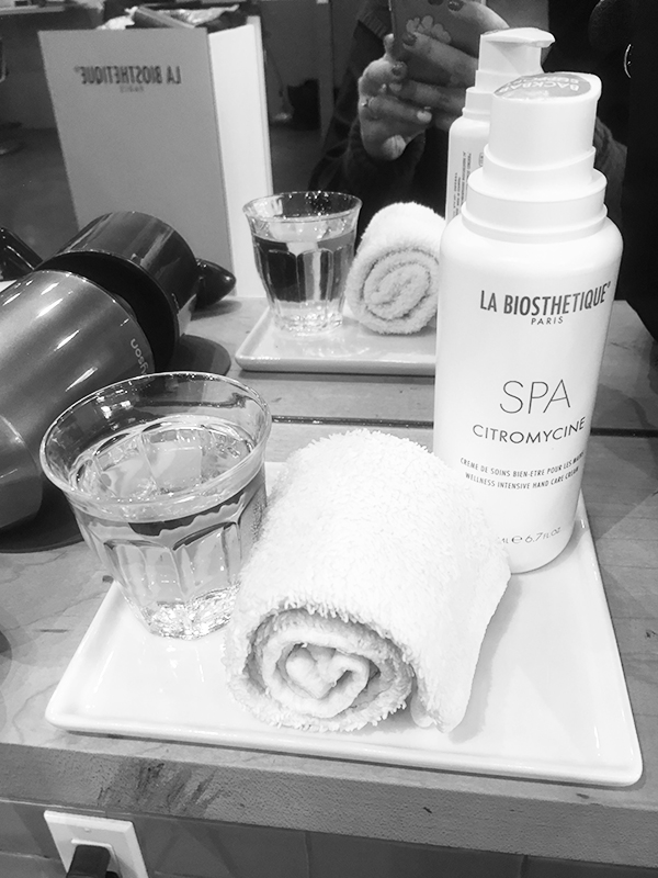 Eliane Hair & Spa hospitality tray with tea, hot towel and La Biosthetique hand lotion