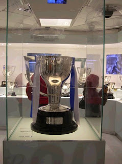 Real Madrid trophy room with a Spanish League trophy