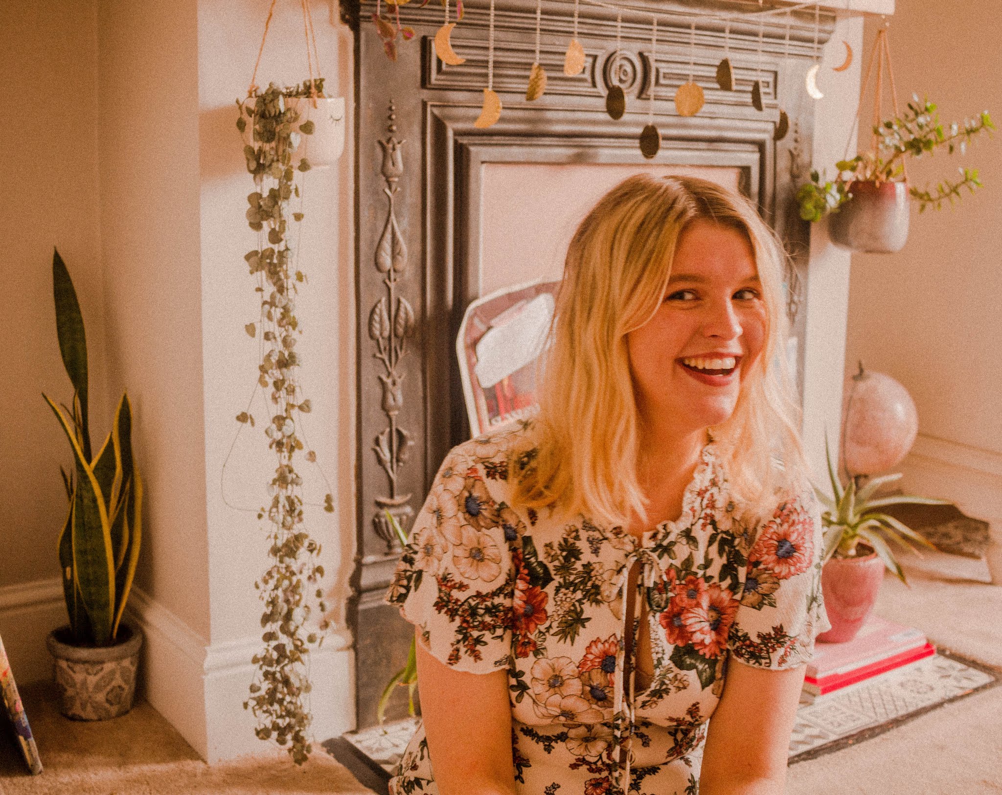 blonde girl laughing with plants - positive little life changes