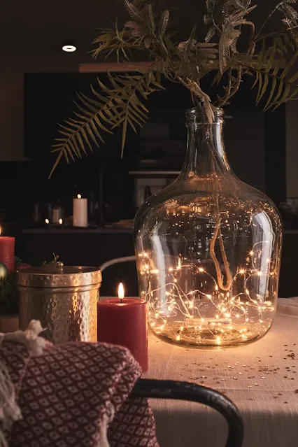 Use everyday decorative objects for a cheap Christmas decoration