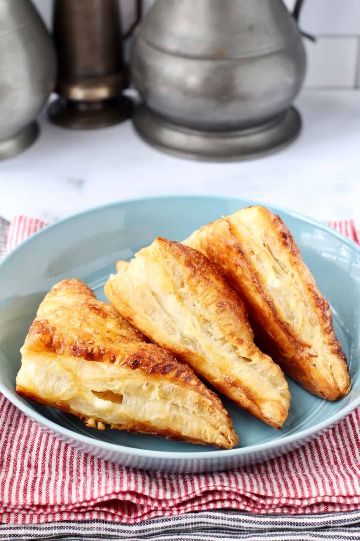 Guava and Cream Cheese Pastelitos in a blue bowl.