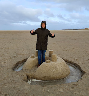 My friend with a sandcastle we found