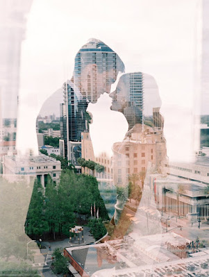 bride and groom with city skyline