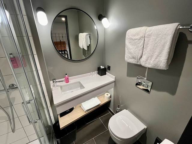 A clean and functional hotel bathroom