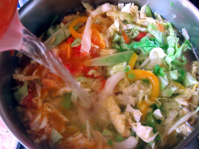 Croatian cabbage soup by Laka kuharica: Add cabbage and water.