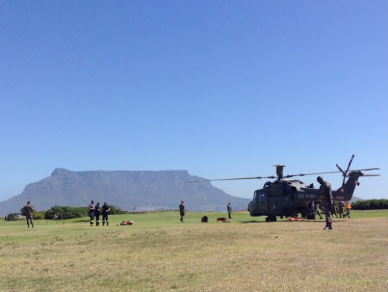 The navy helicopter's cockpit caught fire, forcing it to make an emergency landing