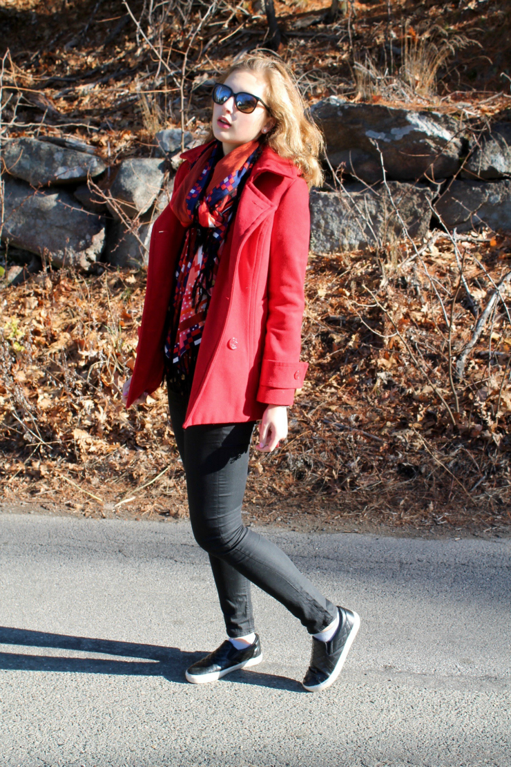 Red peacoat, red lipstick, black skinny jeans