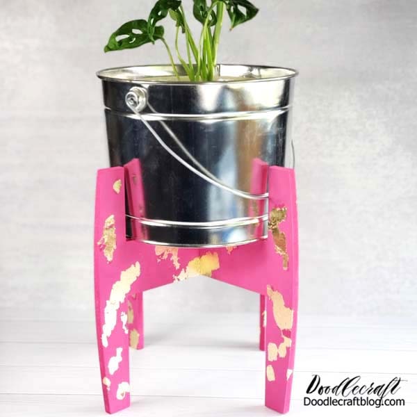 This cute stand does not only work for plants!   It would be a cute way to store office supplies, even a small trash can, a bouquet of fresh cut flowers, a fruit or serving bowl and more!