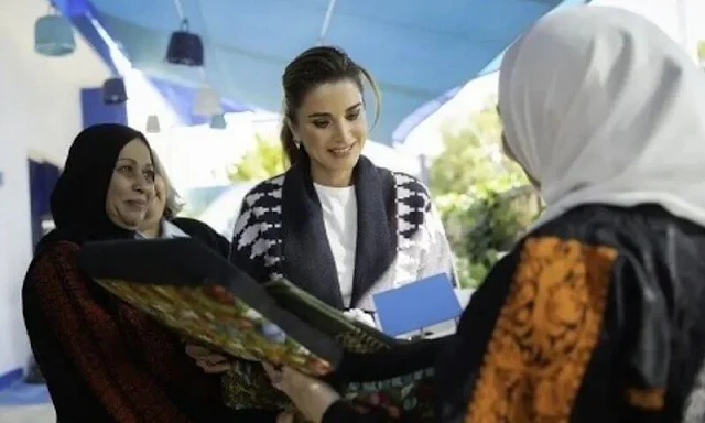 Queen Rania wore a new Argyle organic cashmere cardigan by Le Kasha. Alexander Wang tailored trackpants