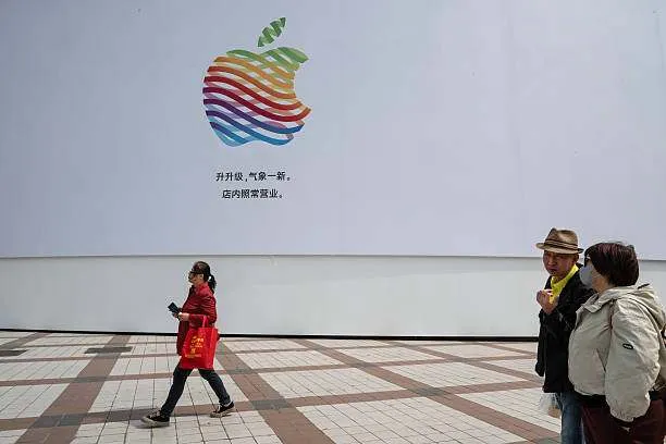 People walk past an Apple store undergoing partial renovation in a commercial district on April 8, 2025, in Beijing, China. Photo by Kevin Frayer/Getty Images