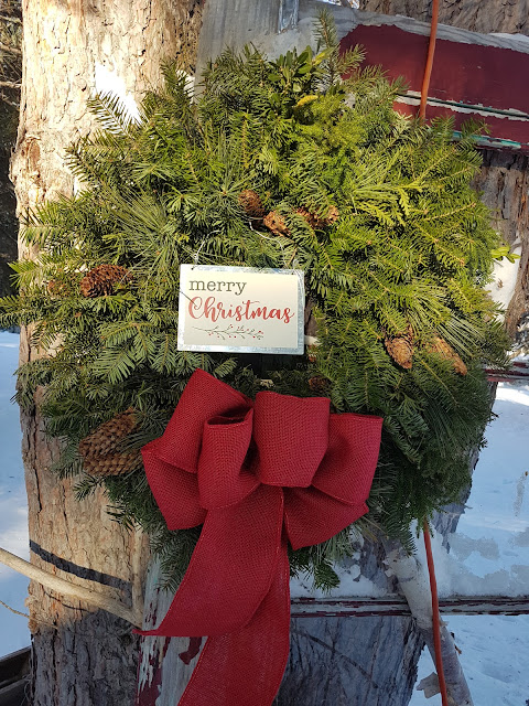 custom wintergreen wreath with red bow