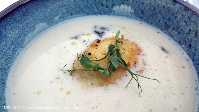 White asparagus velouté with cripsy poached egg and black trumpets