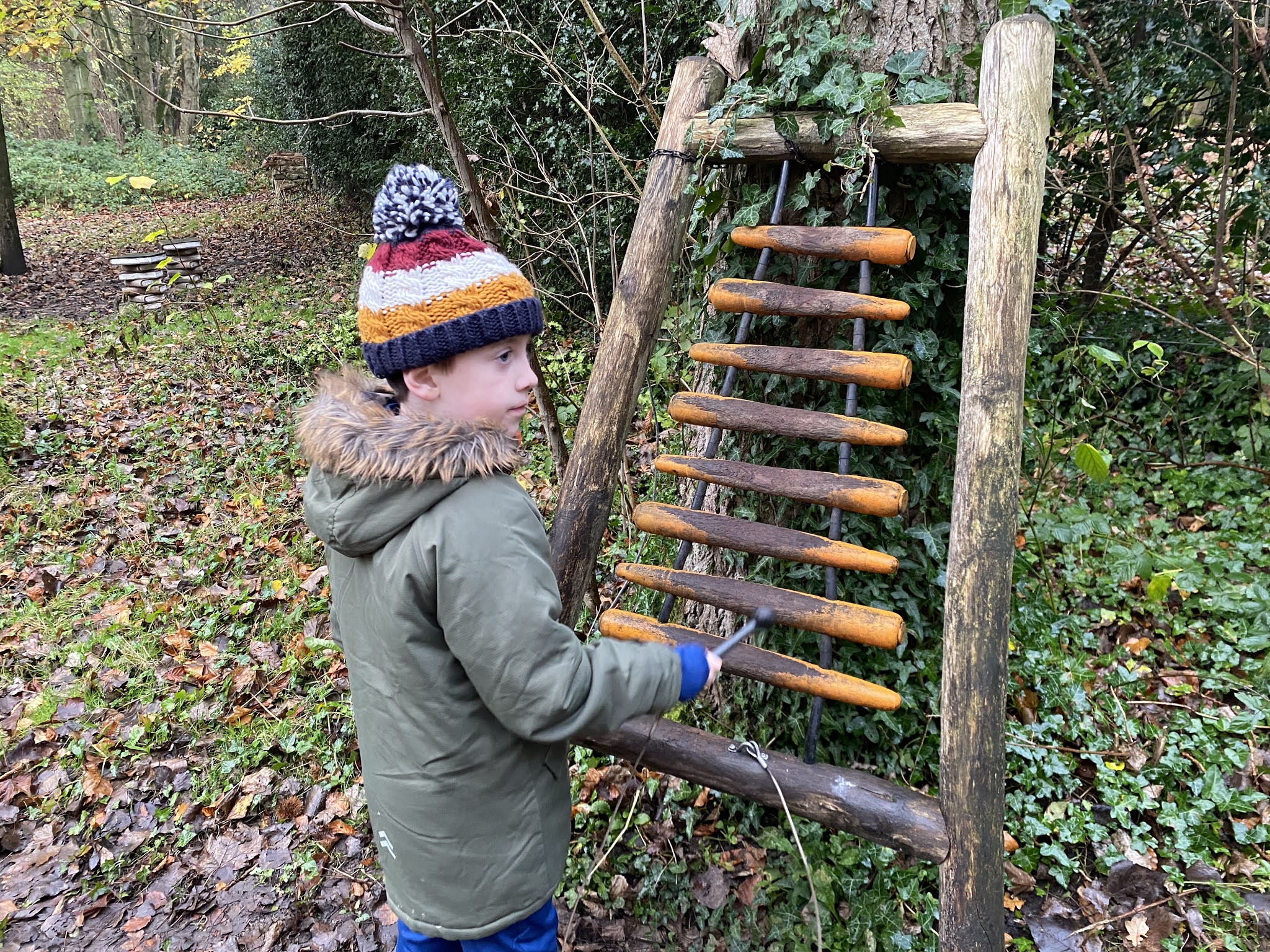 boy playing woodland instruments