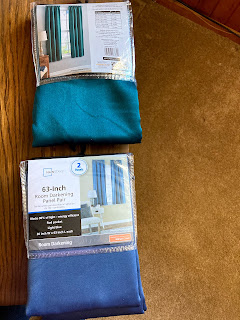 Two packages of polyester curtains