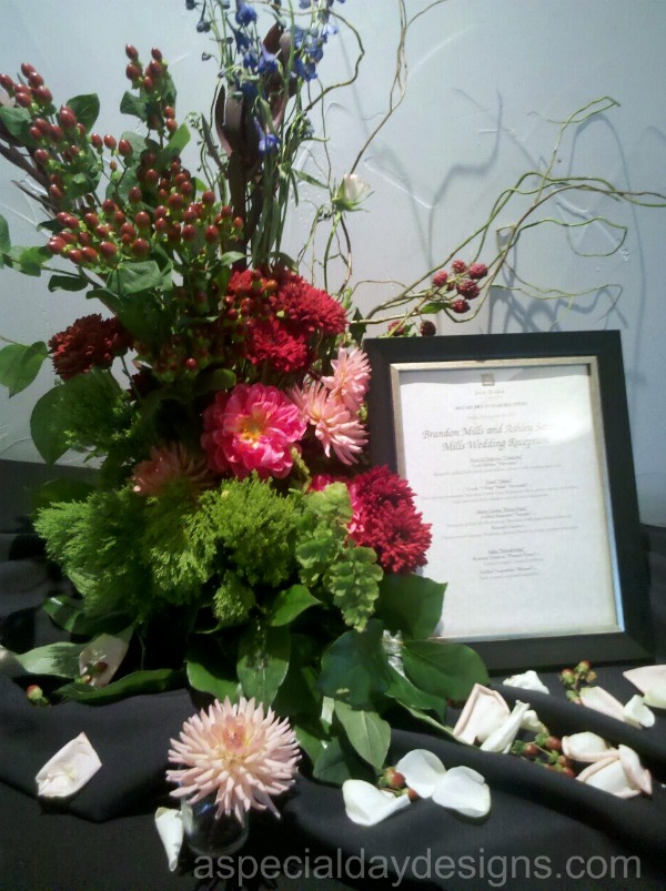 The ceremony bouquet repurposed at the wedding reception buffet