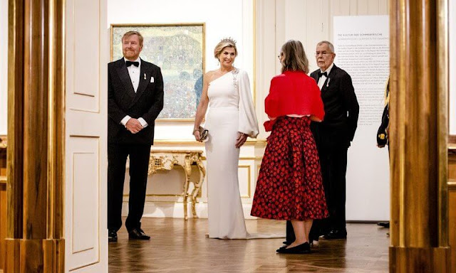 Queen Maxima wore a white one-shoulder stretch cady gown by Stella McCartney. Antique pearl tiara, earrings and brooch