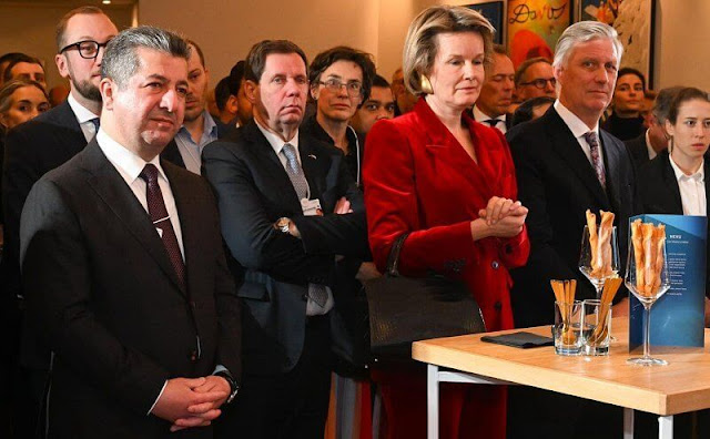 Queen Mathilde wore a red velvet double-breasted suit blazer by Dries Van Noten. Armani jacket and Natan dress