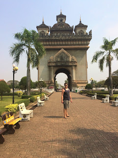 James outside the Patuxai.