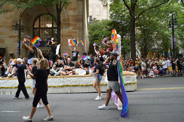 People carrying pride flags