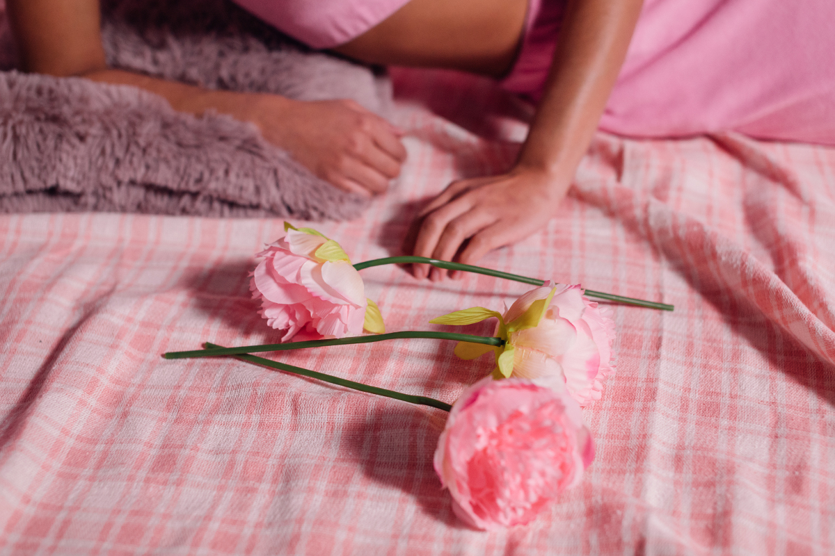 aesthetic flatlay of pink roses on pink blanket