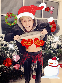 Miley Cyrus Flashes Her "Boobs" in Christmas Photo to "Free the Nipple"