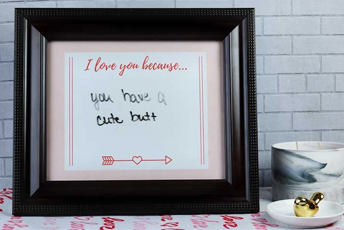 This is an easy Valentine's Day DIY project for home. Use free printables to make an 8x10 frame dry erase sign. Use as decorations or for a gift for him, for her, or for kids. This can be romantic or funny or change it daily. This is a cheap Happy Valentine's Day craft that just needs paper and a cute frame.  Save money with homemade crafts and ideas like this cute sign. #sign #printable #valentinesday