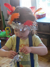 crowned toddler, feathers