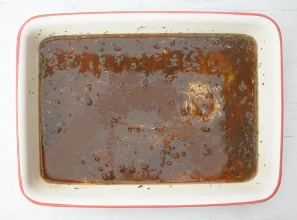 Making mushroom rice bake - step three - gravy is poured over the rice