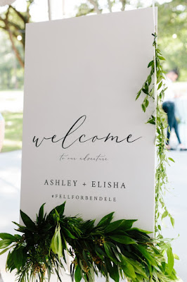 sleek white and green wedding welcome sign