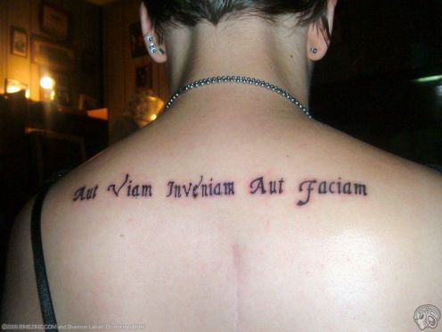 the Latin phrase tattooed on her shoulder during a visit to Universal