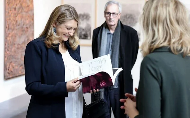 Pregnant Hereditary Grand Duchess Stephanie wore a white ruffle silk blouse by Boden, and blue navy jacket by Anne Fontaine