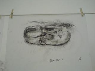 Black and white conte drawing of Josie's shoe